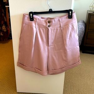 Cider. New, never worn. Pink dress shorts. Pleaded. Size large. Double button.
